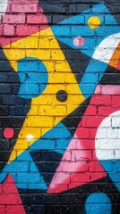 Colorful geometric abstract painting on a brick wall