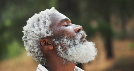 Outdoor, nature and black man with breathing for hiking, holiday and adventure for relaxing on...