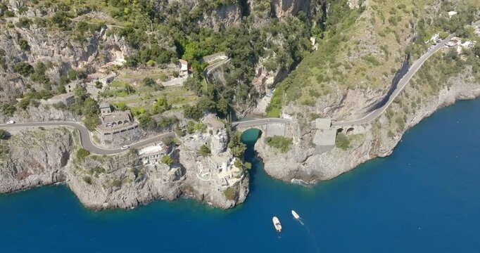 Aerial view of the Furore fjord bridge, a little hidden treasure of the Amalfi Coast, in the province of Salerno, Campania, Italy. The road that crosses it is the Amalfi Drive.