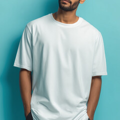 Mockup Indian male model wearing white oversized T-shirt, isolated on light blue photo studio background, Ai generated images