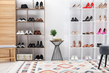 Shoe storage. Shelving units with different footwear and other furniture indoors
