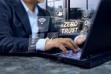 Zero Trust concept with businessman working with security system where every user or devices must be authenticated before being granted access to organization’s systems, applications, or assets.