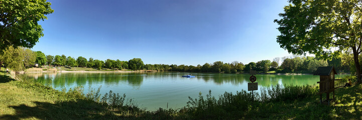 Germany, Bavaria - lake of Garching near Munich, panoramic view in spring