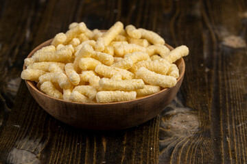 corn sticks for eating or making breakfast with milk, corn sticks in a wooden bowl