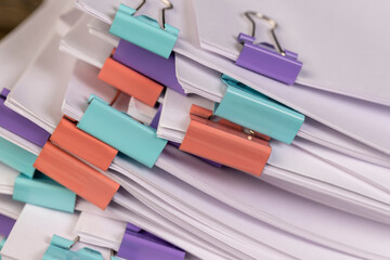 sheets of paper are connected by clips, paper for documents are joined together, the sheets of...
