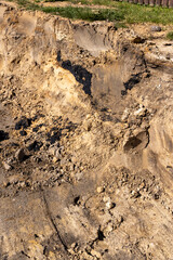 territory before asphalting a road, a hole in the ground on the site of which a highway was started, side view