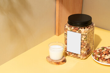 Assorted nut snacks in transparent packaging, blank product labels, baked healthy delicacies