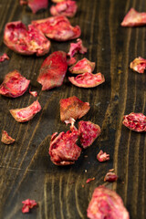 the peel from red pomegranate on a table, red pomegranate peel in the kitchen, close up