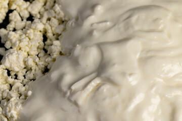 sprinkled with liquid sour cream, lumps of freshly made fermented milk product, close up