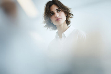 portrait of robotic engineer positioned on left side of frame with thoughtful expression