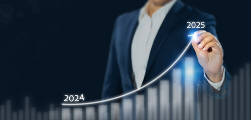 Business growth forecast in 2025. A businessman projects an upward trend line from 2024 to 2025...