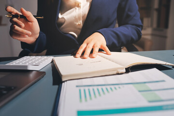 Expert woman asian female people review data number costing managerial account prepare monthly...