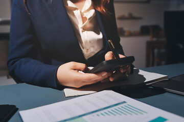 Expert woman asian female people review data number costing managerial account prepare monthly...