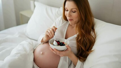 Pregnant Woman Eating Healthy Breakfast in Bed – Prenatal Nutrition and Self-Care - Powered by Adobe