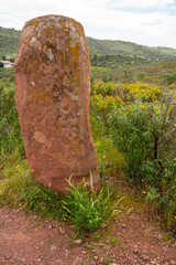 Megalithic menhir dos Gregorios ancient landmark standing stone in lush field megalithic monument...