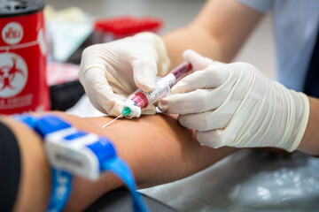 Close up hand of nurse, taking blood sample from a patient in the hospital