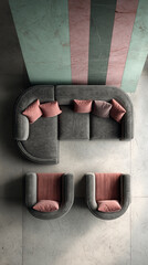 Overhead view of gray curved sofa and armchairs with pink cushions against a teal and pink wall, showcasing modern furniture arrangement in a minimalist interior design