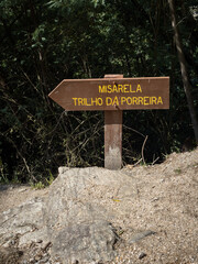 Wooden sign indicating the Misarela bridge, on the Porreira trail. Montalegre, Portugal.