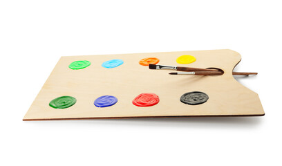 Wooden palette with paints and brushes isolated on white
