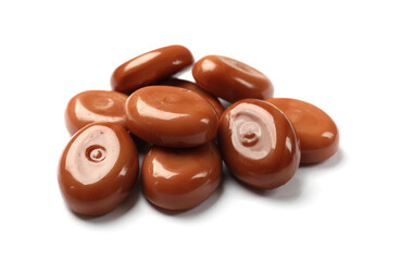 Tasty sweet caramel candies isolated on white
