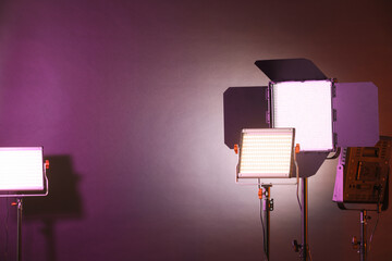 Professional lighting equipment on color background. Space for text