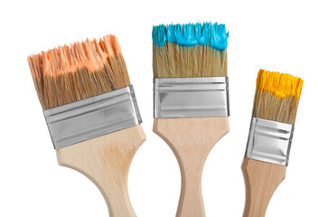 Brushes with different paints isolated on white