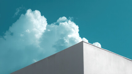 A corner of minimalist architecture under blue skies and white clouds