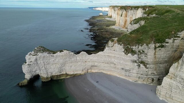 Aerial high angle shot of etretat and famous natural landmark Falaise of Aval white cliffs