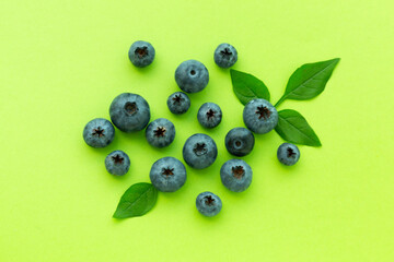 Fresh bright blueberries on color background,top view