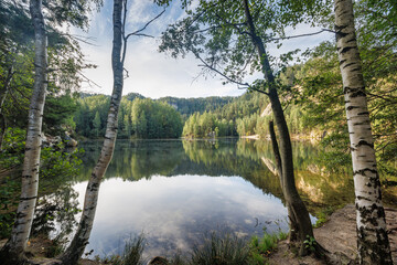 The Piskovna lake in Adrspach-Teplice Rocks area, in Hradec Kralove Region in the Czech Republic,...