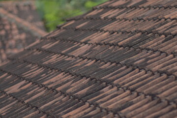 Detailed view of a weathered clay tile roof