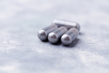 BCAA amino acids tablets. Nutrition for bodybuilding. Fitness supplements on bright background. Soft focus. Copy space.