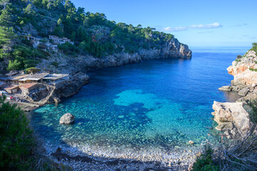 The beach of Deia in the morning light on the island of Mallorca, Spain