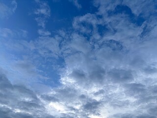 Obraz premium bright blue sky background with beautiful white clouds, clear sky in the afternoon