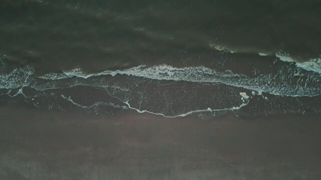 Serene Waves Crashing: Aerial Beach View