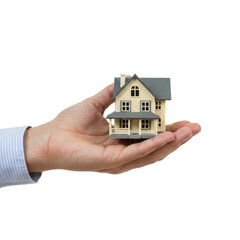 hand holding house