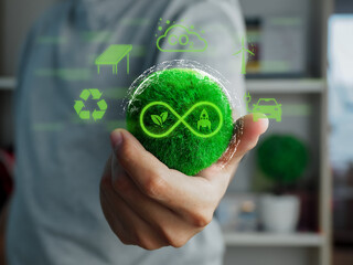 Hand holding or holding green earth in environmental concept renewable energy, recycle, renewable and clean energy symbol of business sustainability net zero return environmental development concept.