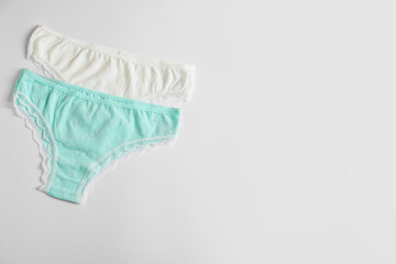 Women's underwear. Beautiful panties on white background, flat lay. Space for text