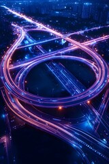A complex highway interchange illuminated at night, with streaks of light from traffic