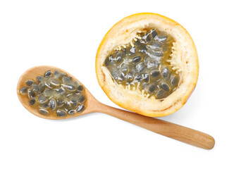 Ripe passion fruit, seeds and spoon isolated on white, top view