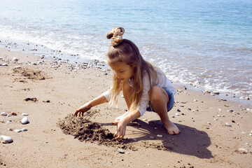 little cute girl on beach, lifestyle people concept