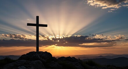 Christian Cross Silhouette on a Rocky Peak at Dawn with Sun Rays