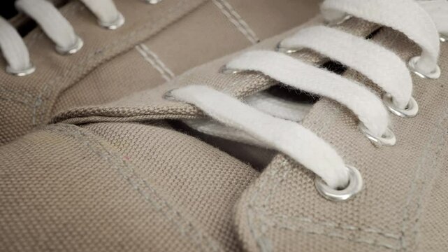Plimsolls laces extreme close up stock footage