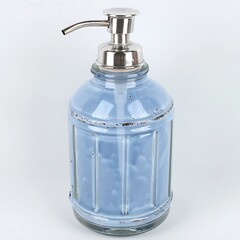Obraz premium Elegant blue ceramic soap dispenser with metallic pump for bathroom or kitchen decor