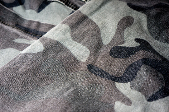 A close-up of a piece of clothing made of camouflage fabric