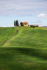 Val d'Orcia, Tuscany, during spring time with green fields.