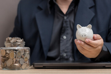 man hold piggy bank for Smart Savings and Investments for Financial Growth. strategies for saving money and