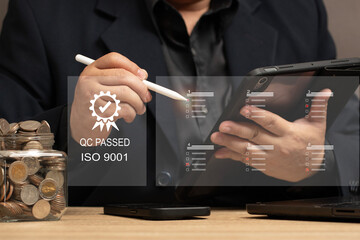 Quality Assurance in Financial Investments and Business Services. man reviewing quality control checklists on a tablet, ensuring service excellence and customer satisfaction. QC PASSED ISO 9001.