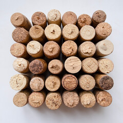 square made of wine corks on white background, geometric textured pattern