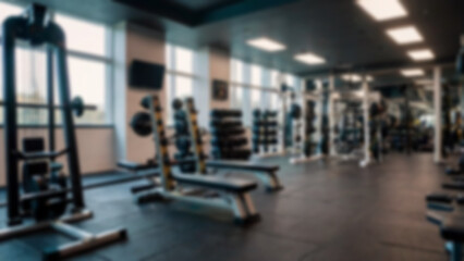 Fototapeta premium Abstract blurred fitness center with equipment as background, modern theme with complete equipment, bright light, blurred gym background.